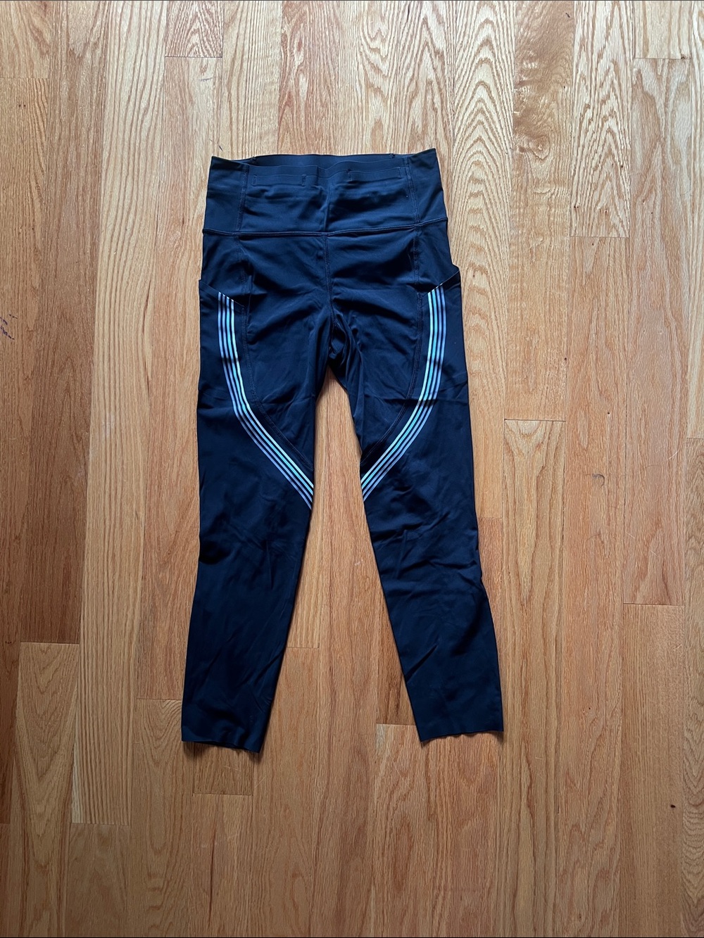 lululemon athletica Black Leggings with Light Blue Reflective Stripes.
